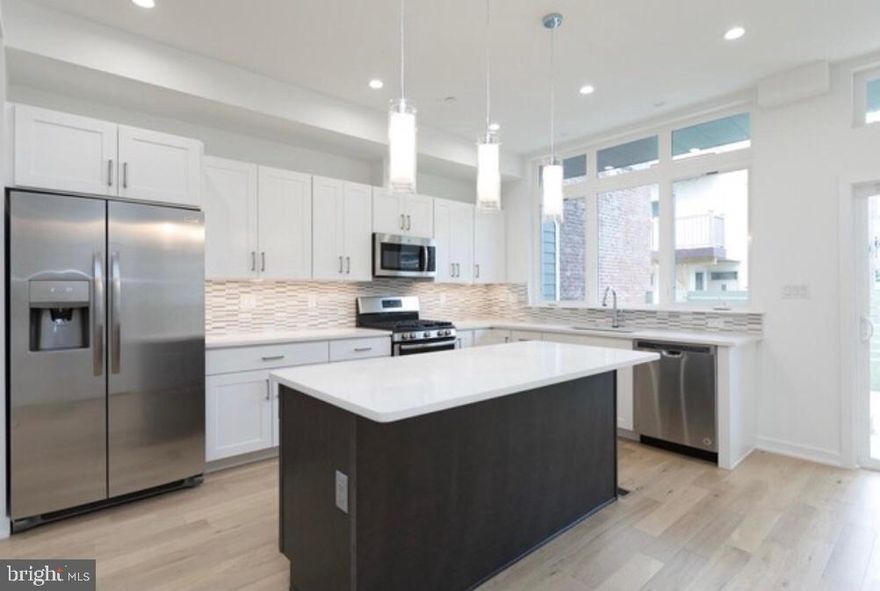 Beautiful three bedrooms, two and a half baths, open floor plan unit available.  Hardwood floors throughout the living room and kitchen area. Quartz countertops with center island, stainless steel appliances and lots of cabinet space. Slider doors from your kitchen which leads directly into the deck/yard space.  Master bedroom has private outdoor space as well. This unit features high end finishes including large windows, high ceilings, modern appliances, full size shower/tub, and ceramic bathroom tiles. Plenty of closet space throughout the unit.  Master bathroom located inside of the master bedroom. Walk in closets and ceiling fan in master bedroom.  Washer and Dryer in the same level as the bedrooms.  Walking distance to Frankford Ave Corridor and surrounding neighborhood establishments like Memphis Taproom, Loco Pez, Philadelphia Brewing Company and much more. Close proximity to Fishtown Crossing Shopping Center. Easy access to public transportation,  I95 and BF Bridge.