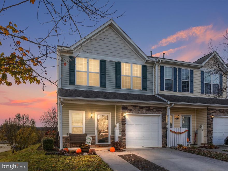 Welcome to this inviting three bedroom, two and half bath townhome that perfectly blends comfort, style & convenience.  This charming unit boasts an entry level entrance for easy access, along with an attached one car garage and extended driveway for additional parking and flexibility.  Step inside to find updated flooring and fresh paint throughout, creating a modern and move-in ready atmosphere.  Spacious living area flows seamlessly into the bright, open kitchen, ideal for both everyday living and entertaining.  Outside enjoy your patio perfect for morning coffee, barbeques, or relaxing.  With all the essentials and more, this end unit townhome is waiting for its new owner to make it their own!