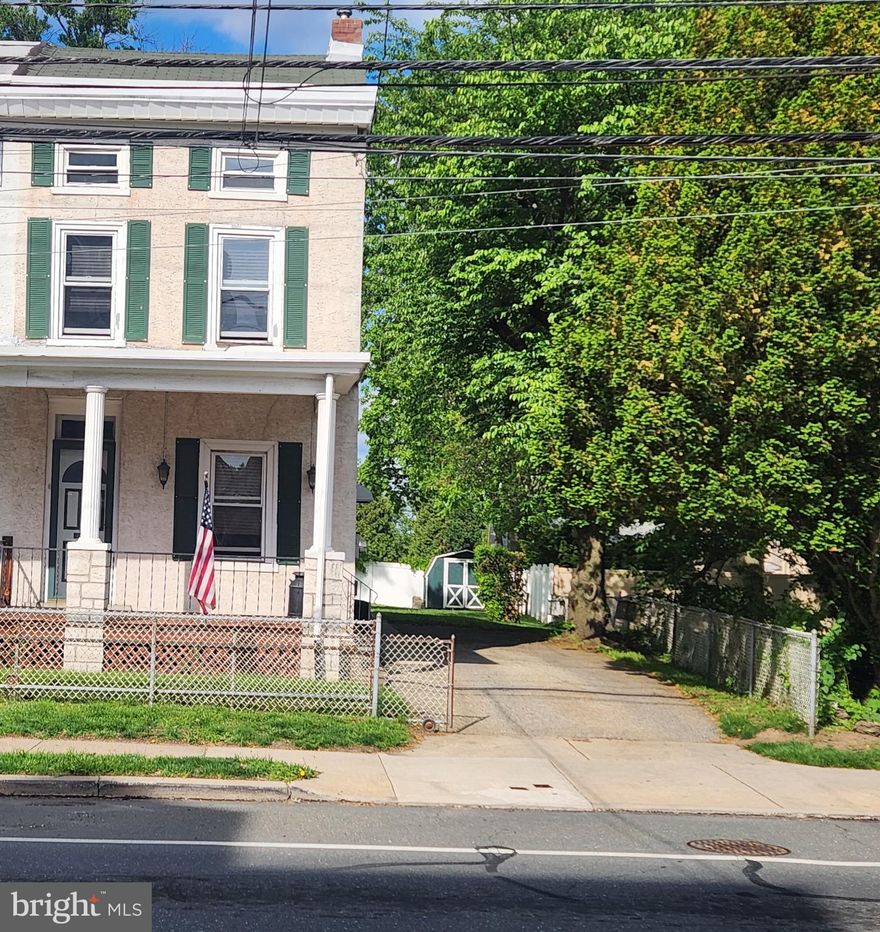 Welcome to this spacious and inviting twin home, ideally situated in the heart of Roxborough. Located within the Ridge Avenue Historic District, this residence blends timeless charm with historic significance in one of Philadelphia’s most storied neighborhoods, offering the rare and valuable convenience of off-street parking. Inside, you'll find beautiful hardwood floors, three generously sized bedrooms, ample deep closet space, and a full hall bathroom, all designed for comfort and everyday functionality.
The clean and versatile basement includes laundry facilities and direct walk-out access to the yard, making everyday chores a breeze. Outdoor living is the true highlight here, with beautifully landscaped spaces accessible from the kitchen and the basement, perfect for gardening, entertaining, or simply unwinding in your private outdoor sanctuary. The spacious backyard also features a shed, providing extra storage space for tools or outdoor gear. It's an easy way to stay organized and keep your new yard looking great. The covered front porch adds another relaxing space to enjoy your morning coffee or evening breeze.
Situated ideally, this home offers quick access to major roadways and public transportation, ensuring an easy commute and convenient access to the vibrant shopping, dining, and entertainment options nearby.