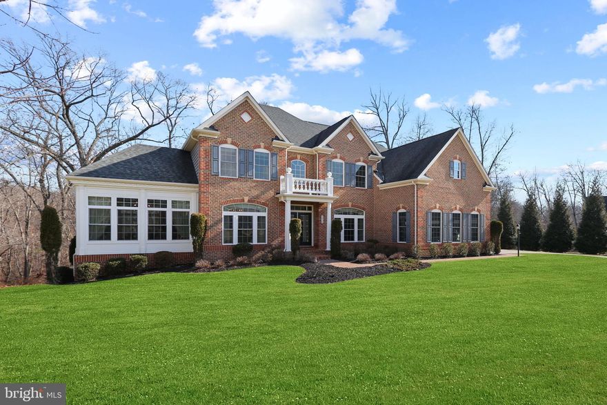 A sophisticated brick home on 2.3 private acres on quiet cul de sac in a beautiful neighborhood bordered by towering trees and green space. Open floor plan, contemporary elements, and timeless fine finishes include hardwood floors, custom cabinetry, unique architectural details, tray ceilings and extensive millwork. Stunning two-story foyer with elegant staircase opens to the formal dining room and living room leading to impressive conservatory. Casual living spaces include handsome study, and large family room with soaring ceiling, Palladian window and built-ins flanking gas fireplace. Gourmet soft-white kitchen features a walk-in pantry, butler’s pantry, a 5-burner gas cooktop, double ovens, GE Profile side-by-side refrigerator, and an expansive one-level island with breakfast bar adjacent to spacious light-filled morning room. The second level is complete with primary bedroom suite with two walk-in closets, a spacious lux bath with two sinks, shower, and soaking tub, and three additional bedrooms and two baths - one ensuite bath and one shared. The finished walk-out basement with bedroom five and fourth full bathroom offers abundant storage, and a huge recreation room with game and media areas, sitting room for homework, and fitness center. A convenient main level laundry and mudroom opens to the generous 3-car garage. Enjoy the large Trex deck for alfresco dining or venture out to enjoy the kitchen garden, woodlands, or spacious yard for play. Conveniently located on the popular Falls Road Corridor close to school, a buzzing neighborhood village with grocery and shops, and just minutes north of Greenspring Station and I-83 for quick commute to the Best of Baltimore on the harbor. A great location and thoughtful design can simplify life and make life more meaningful – at home.