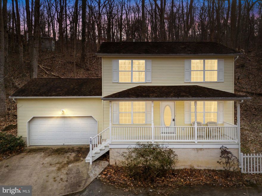 Step into the comfort of this 3-bedroom, 2.5-bath Colonial located in the peaceful Shannondale community of Harpers Ferry. Nestled on a wooded lot, this home offers privacy, nature, and exclusive access to Shannondale Lake for fishing, kayaking, and outdoor enjoyment—all with no HOA restrictions!

The inviting front porch welcomes you into a bright and airy living room and dining area, featuring just-refinished hardwood floors. The fully-equipped kitchen boasts granite countertops and provides direct access to the spacious back deck, perfect for entertaining or relaxing in the tranquil backyard. A half bath completes the main level.

Upstairs, the primary suite features a walk-in closet and an attached bathroom. Two additional bedrooms share a hall bath, offering comfortable accommodations. The large driveway and 2-car garage provide ample parking and storage space.

Enjoy the best of small-town living with modern conveniences—this home is just minutes from Harpers Ferry National Historical Park, the Appalachian Trail, the Shenandoah & Potomac Rivers, and local dining & shopping.

Don’t miss this opportunity to own a serene retreat in Shannondale! Schedule your private showing today!