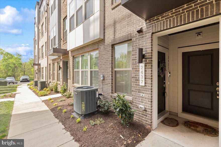 A true gem, this beautifully maintained, light-filled condo feels better than new and has a great open layout with modern finishes throughout. The main level features 9-foot ceilings, wide plank flooring, and a spacious living area with recessed lighting that flows right into the kitchen. The kitchen is perfect for everyday living or entertaining, with quartz countertops, 42-inch cabinets, stainless steel appliances, a refrigerator with ice maker and water dispenser, dishwasher, microwave, breakfast bar, a large walk-in pantry, and plenty of storage. There’s also a convenient powder room with a pedestal sink on this level.

Upstairs, you’ll find 9-foot ceilings and a large primary suite with recessed lighting, an oversized walk-in closet, and a private en-suite bath with ceramic tile flooring, quartz countertops, and a walk-in shower with a built-in seat. The two additional bedrooms both have custom lighting with fan and dual closets, and one includes access to a low-maintenance deck. A second full bath with ceramic tile flooring and granite countertops, plus a washer and dryer upstairs, make things even more convenient.

Other features include a one-car garage, private driveway, and extra parking behind the unit. The location is a big plus, minutes to the Silver Line Metro at Innovation Station, and directly across from Village Center shopping with restaurants, retail, and grocery stores. You’ll also have easy access to Downtown Herndon, Route 28, Fairfax County Parkway, the Dulles Toll Road, and Dulles International Airport.
