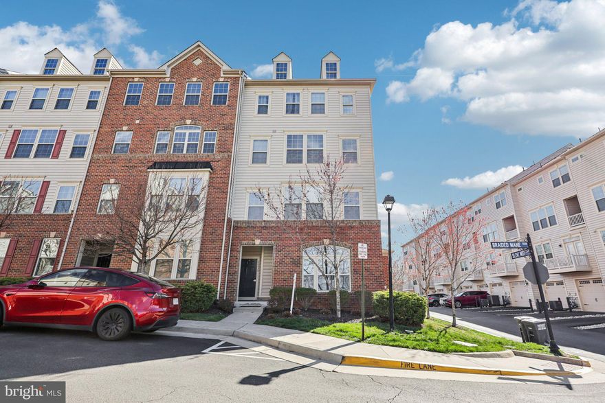 Welcome to this light-filled end-unit townhome-style condo offering 3 bedrooms, 2.5 bathrooms, and an attached garage in the sought-after Virginia Manor community. The main level features an open floor plan with high ceilings, abundant natural light, luxury vinyl plank flooring, a spacious living area, powder room, and direct garage access. The gourmet kitchen is equipped with granite countertops, stainless steel appliances, espresso cabinetry, pendant lighting, and a walk-in pantry. Upstairs, the generous primary suite includes two walk-in closets and a private bath with a granite double vanity and dual-head shower. Two additional spacious bedrooms share a full hall bath, and the laundry room with utility sink is conveniently located on the bedroom level. A private balcony off one of the bedrooms adds outdoor living space. The rear-entry garage provides parking for one vehicle plus driveway space for a second, with ample guest parking throughout the community. Residents enjoy access to pools, a fitness center, clubhouse, tot lots, tennis courts, and scenic walking trails. Ideally located near shopping, dining, schools, Dulles Airport, and major commuter routes including Route 50, Route 28, and 286.