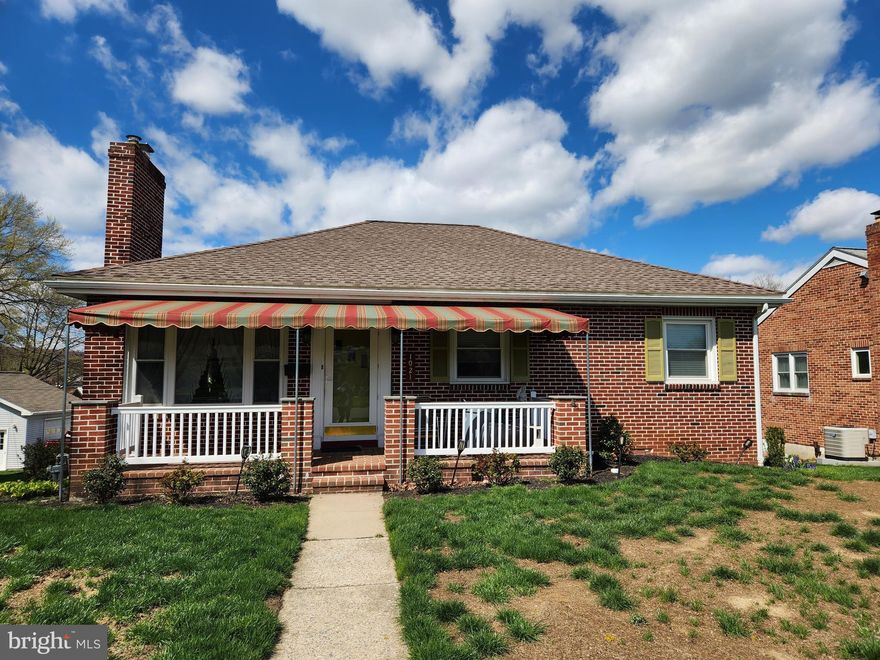 This property will be offered at Public Auction on Thursday, May 22, 2025 @ 6pm.  The listing price is the opening bid only and in no way reflects the final sale price.  10% down due at auction, 2% transfer tax to be paid by the purchaser, real estate taxes prorated. This brick home, nestled in a quiet neighborhood, offers convenient access to Routes 30 and 441. The main level of the home features a cozy living room with hardwood floors and a wood burning fireplace, plus an eat-in kitchen with granite countertops, updated in 2017. The floor continues with three bedrooms and a full bathroom. The walkout basement hosts a family room with an electric fireplace, a full bathroom and a laundry area. Additional amenities include an attached garage, an outdoor deck, and off street parking.