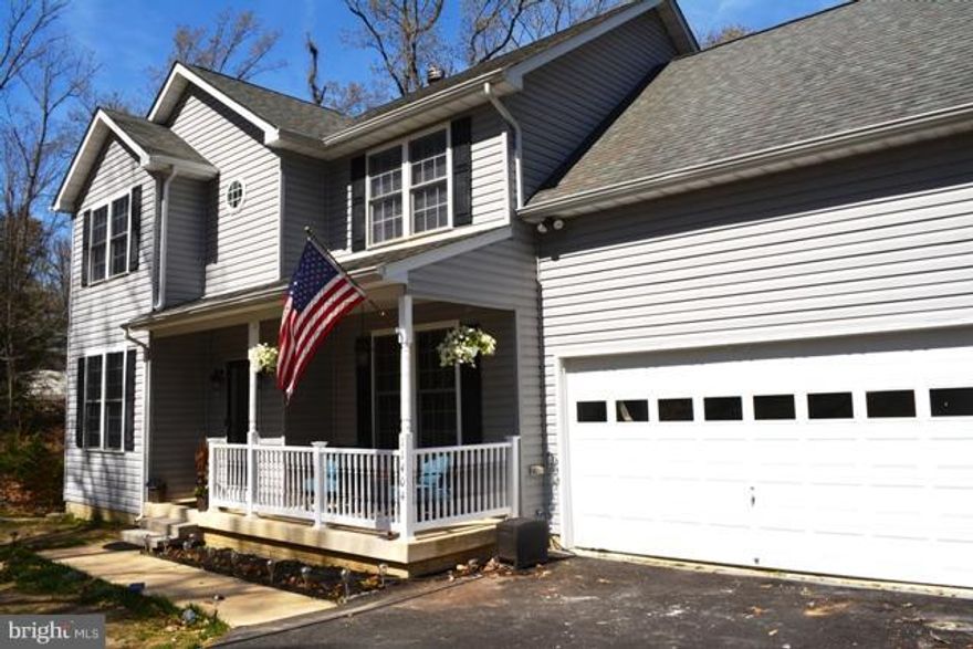 Beautifully appointed newer colonial w/ upgraded baths, kitchen, wood flooring in 90% of the house, beautiful deck, 2 fireplaces, hardscaping,  large lot, oversized garage for storage, HUGE room off of Mstr could be used for nursery/office/4th bdrm/crafts/misc.street light at top of drive belongs to house, **large mster w/ superbath, walk in shower, fireplace, ,. Lusby T.own Center 5 minutes away