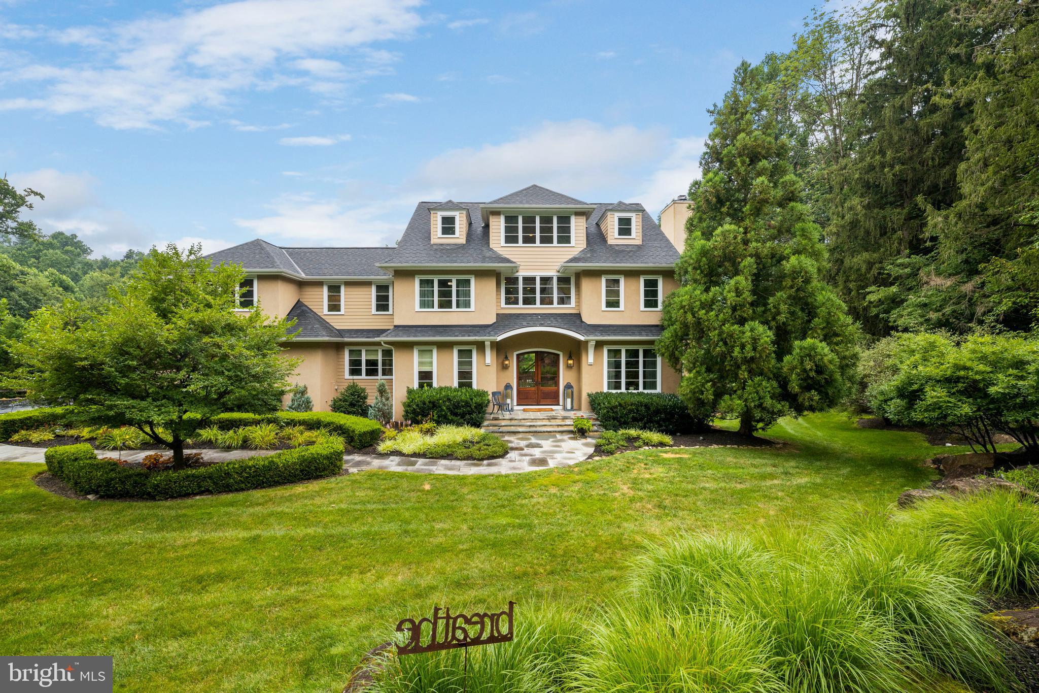 First time on the market and raising the standard for homes!
Masterfully designed and built by award-winning John Diament, this premier quality custom home signifies an investment in unique, custom architectural design with the highest of quality construction. This home is for the discerned buyer looking for quality, luxury, comfort and privacy.
Featuring 4728 square feet of living space which has been meticulously crafted with form and function in mind. Sited on 2.89 acres and surrounded by 10 acres of preserved landscape in the Harmony Farm community, a private enclave of five custom estate homes nestled in the heart of Chester Springs. Meticulously manicured grounds with mature landscaping provide a resort style private oasis with curved bluestone pathways that flow to a large in-ground pool and stone-walled patio with wood fireplace and entertainment area including refrigerator and grill. The outdoor kitchen area is connected to a charming and original circa 1800 springhouse converted into an outdoor pool storage area.
Inside the space is bright and inviting with incredible indoor-outdoor flow along with countless entertaining options. Perfect for both intimate and large scale entertaining.
Raising the standard for homes in this area with premier design, finishes and amenities. Graced with beauty and elegance throughout.
Notable Feature Include:
Pool with Hot Tub. Outdoor area with built in grill, refrigerator and wood fireplace.
Pennsylvania Blue Stone Pathways.
Three car garage with solid mahogany doors, closets, shelving, dog wash and workbench.
Custom kitchen with integrated subzero refrigerator, 48" Wolfe gas stove with 6 burner & griddle, dishwasher & microwave. Oversized island. Honed granite countertops.
Large pantry, laundry with chute, sink & cabinetry.
Dining area opens to deck with pergola and pathway to pool/patio.
Living area offers coffered ceiling, gas fireplace with marble.
Flexible floor plan to accommodate 4-5 bedrooms/1-2 home offices.
Master suite includes foyer, gas fireplace w/ 10' sliding doors and marble bathroom.
Bonus room offers spacious lounge area.
Lower level bar/kitchen, wine cellar, wood fireplace, full bath and additional laundry room with closets. Glass doors open to walkway leading to pool and patio.
Efficient 3-Zone Heating & Air Conditioning
75 Gallon Water Heater
Central Vac
Minutes from Route 100, Route 30 and PA Turnpike