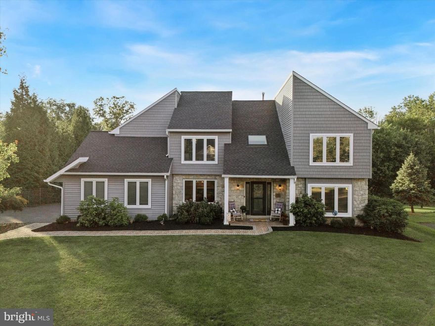 Presenting 222 Windsor Way, a masterfully remodeled two-story colonial in Doylestown that seamlessly blends cutting-edge design with luxurious modern finishes. Step inside to a breathtaking interior featuring gleaming 3/4-inch hardwood flooring, upgraded paint, and recessed lighting throughout the first floor, where a gourmet island kitchen steals the show with quartz countertops, stainless steel Kucht professional appliances, a tile backsplash, a pot filler, champagne bronze hardware, and a brand-new walk-in butler’s pantry for effortless entertaining. A 2023 rear addition, with abundant windows showcasing the space with natural light, expands the home’s living area, creating an airy and inviting atmosphere. The redesigned first-floor mudroom, with convenient driveway access and a new half bathroom, enhances functionality and makes entry a breeze. 
Ascend to the second floor, where the remodeled master suite is a luxurious retreat, offering a beautifully upgraded bathroom with high-end tiling, a walk-in closet with custom built-ins, and a captivating hidden storage room that adds an element of intrigue. Three additional large bedrooms, each generously proportioned, share another beautifully updated bathroom that conveniently connects to a spacious and unique completely remodeled double laundry room with two washers and dryers, simplifying daily chores. 
The finished walk-out basement completes the home with a large recreation room, theater room equipped with built-in Dolby Atmos speakers, billiards room, gym, wet bar, and a full bathroom, perfect for hosting unforgettable gatherings. 
The backyard is a private paradise, featuring a heated in-ground saltwater pool with new 2025 equipment, a spacious rear deck, and a patio with a fireplace, speaker system, and a hot water hose bib for hot tub filling, all set against the backdrop of stunning rear sunsets. Enhanced with new landscaping and a fenced yard for privacy, the property backs to permanently preserved open space with a walking trail leading to Doylestown’s charming downtown and Kids Castle Central Park, claiming the neighborhood’s most coveted lot. 
This exceptional home is further elevated with a newer roof, siding, windows, doors, a freshly resealed driveway, upgraded electrical and plumbing systems, a 2023 two-zone HVAC, a tankless water heater, a water softener, an electric car charger in the garage, a generator hookup, and a fully floored attic providing approximately 1,400 sq. ft. of storage. With its unparalleled design and amenities, this unbelievable home is perfect for entertaining guests, making it an extraordinary residence that redefines sophisticated living—schedule your private tour today to experience the finest home in Doylestown!