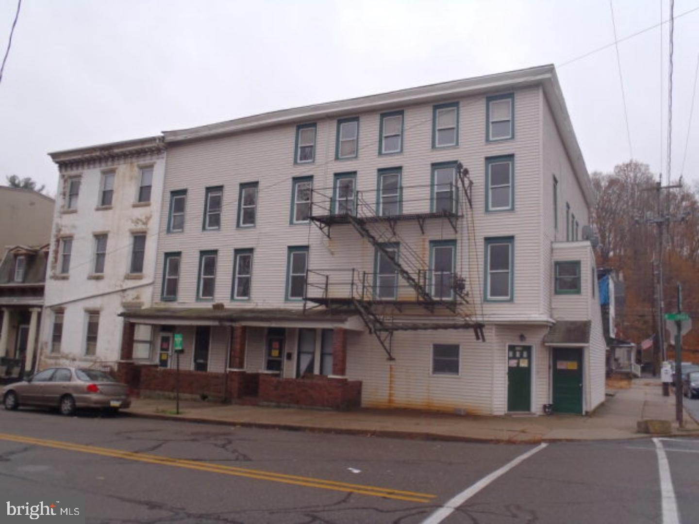 Unit 7: Unrentable. 7 Unit (6 Rentable) Apartment Building spanning 328-332 West Broad St & 1 S. Lehigh St, at the corner of Broad & Lehigh Streets. Some units have rear porches/decks. Property is in Historic District and Flood Zone. Property is being Sold As-Is. Buyer is responsible for contacting the proper municipal departments to determine if any violations, repairs, or inspections are required. IMPORTANT: Property has been condemned, and Notice of Unsafe Structure document is uploaded and attached to listing. Mailing Address Continued: Tamaqua Amps/#Meters: 8 meters Municipal Inspection Required: Y Building Type: 3 Story Apt Bldg