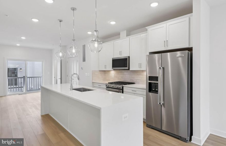 The 4-level Baywood Way townhome with 1,791 square feet.  The home offers 3 bedrooms, 4th floor loft & rooftop terrace for outdoor entertaining or soaking in the sun, and a 2-car tandem garage. The open concept main level features a large center kitchen island and included deck off the kitchen The Primary Suite offers sizable dual walk-in closets and on the same level you will have spacious secondary bedrooms and a convenient walk-in laundry room. Farmstead District in Rockville, MD is a blend of modern living while offering everything right outside your front door. This community offers 370 new homes and Pulte Homes will be offering 212 home at Farmstead offering both 4-level townhomes and 2-level condos.  Upscale community amenities await residents—a symphony of convenience and leisure. Imagine living under 1 mile from the Shady Grove Metro with easy access points to I-370 and I-270, your daily commute becomes a breeze. The vibrant tapestry of 270 Center, RIO, and Downtown Crown lies just minutes away, inviting you to explore, dine, and savor life’s little pleasures.  But it’s not just about proximity; it’s about the rhythm of everyday living. Take a leisurely stroll to Upper Rock Circle, where culinary delights await. Cava, CVS, Mom’s Organic Market, Nums Yums Bakery, Safeway, Coffee republic, Botanero Wine Bar, Nagoya Sushi, and Firehouse Subs.   Just outside, you are steps from pickleball, tennis, basketball, the dog park and everything J.T. Stepanek park has to offer! 

But wait, there’s more—a hidden gem that ties it all together. The Barn, Farmstead District’s community center, offers a modern fitness center, seasonal pool, fire pit, grills, and multiple seating areas. With room for year-round entertaining, the Barn is designed to elevate your everyday living experience.