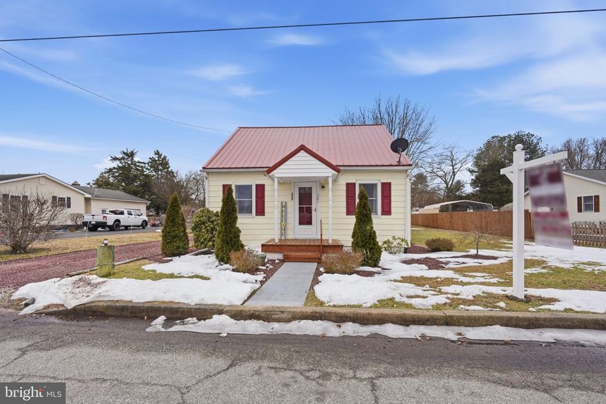Charming and affordable 2-bedroom, 1-bath bungalow tucked away on a quiet street. This move-in ready home has been well maintained and features a newer metal roof for long-term durability and peace of mind. Ideal as a starter home or for anyone looking to downsize without sacrificing space. Enjoy a large lot plus a detached two-car garage complete with electricity and propane heat — perfect for hobbies, storage, or a workshop. Conveniently located just minutes from Route 301 for an easy commute while still offering a peaceful setting.
