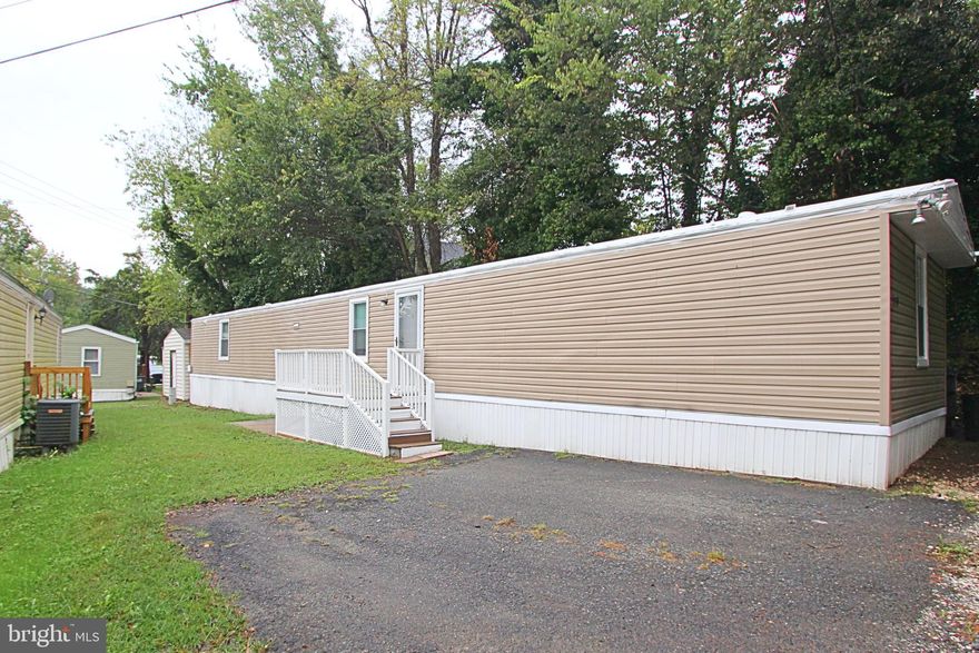 Updated, well-kept, and easy to love. This 3-bed, 2-bath mobile home has been thoughtfully brought up to date over the years, with a clean, comfortable feel the moment you walk in. The layout lives easy—bright living area, practical kitchen, and bedrooms with real breathing room. The location is a win: minutes to I-95, US-1, Stafford Courthouse, commuter lots, VRE stations, shopping, dining, parks, and everyday errands. Outside, the low-maintenance setup means more weekend and less workload. Served by Stafford County schools and priced smart for today’s market, this is the “it just makes sense” kind of home—move-in ready with room to make it yours.