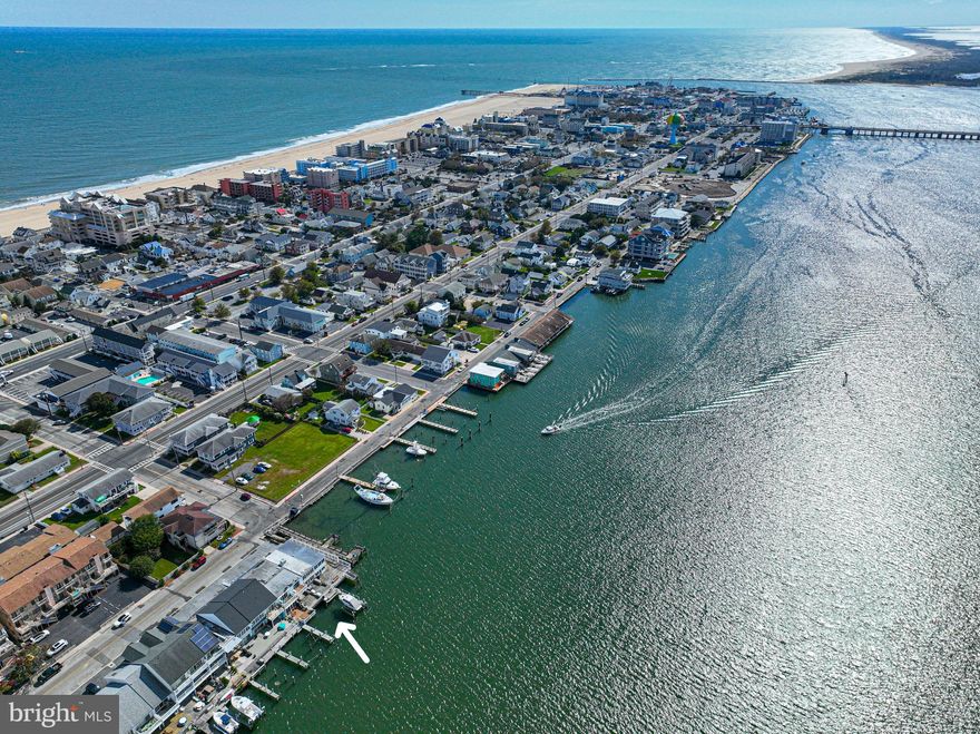 Welcome to your waterfront oasis in the heart of Ocean City, Maryland! This three-bedroom, three full bathroom townhouse offers breathtaking views of the bay on both levels. Step inside and be greeted by an open and spacious floor plan, perfect for entertaining family and friends. The main level features a bedroom with a full bathroom and washer and dryer. The kitchen and living area are generous in size and offer an open concept feel.  Upstairs, you'll find the two additional bedrooms and two additional full bathrooms along with another washer and dryer. Off the bayfront bedroom you can enjoy sitting on the upstairs deck area. Off the living room you can enjoy your own private deck that provides the perfect spot for outdoor dining, relaxation, and enjoying the gentle bay breezes with a slip outside your back door. NO CONDO OR HOA fees! Whether boating, kayaking, or simply dipping your toes in the bay. Located in the heart of downtown Ocean City where you have the famous boardwalk, restaurants, entertainment, shopping, and night life.