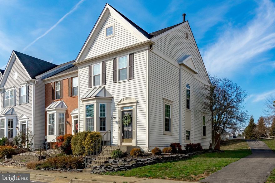 OFFER DEADLINE SUNDAY 2/4/2024 7 PM. Don't miss this lovely, updated, end unit in highly sought after Windgate. This townhome welcomes you with hardwood floors on the main level and tons of windows you cannot get in an interior unit.  It truly makes a difference with extra natural light and cross breezes on a nice day. The eat-in kitchen with white cabinetry, new hardware, new quartz countertops and newer stainless appliances is the perfect spot for hosting your guests.  You will love the pass-through window that connects this space to the main living area.  From the dining room,  exit out to the oversized deck with only a few steps out to the walking paths.  The view from the deck is private and almost feels like a country setting. There is a main level powder room, coat closet and full pantry as well. The primary bedroom is complete with vaulted ceilings and a  walk-in closet outfitted with custom organization.  The en-suite bath has been updated with quartz countertops, custom lighting and new hardware.   Two other bedrooms and a hall bath complete level two.  The lower level has a gorgeous built-in 'dry bar' with beverage refrigerator and quartz countertops.  The gas fire place is ideal for cozy nights in.  There is laundry and ample storage space in the unfinished section  as well as plumbing to add a third bath.  Enjoy the walking trails, a playground and the central location  which is close to everything Annapolis has to offer and commuter routes. You can be in Downtown Historic Annapolis, the bustling shopping and dining district of West Annapolis, at the Mall or the Annapolis Town Center each in under 5 minutes! ***NEW ROOF 2022, ALL NEW WINDOWS 2023, NEWER APPLIANCES, NEW HOT WATER HEATER 2019