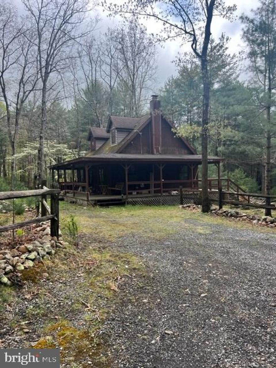 Great chance to have a country getaway for under 180,000. Over 10 usable acres in two parcels. One is 6.59 and the other 4.11.  Lots 10 and 11 Sec E. Cabin needs modernizing. Only has an old fashioned wood cooking stove for heat. Beautiful stone behind stove. Cathedral ceilings with dual ceiling fans. Large loft are upstairs.  New flooring, painting and new appliances would really improve the place. Great fishing, great hunting areas nearby.  An Appraiser may not consider loft as bedroom.