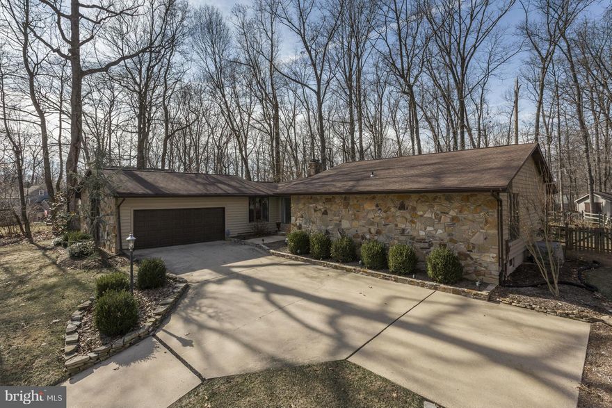 Immaculate Fully Renovated Rancher on Large Private Lot Backing to Woods! Spacious Gourmet Eat-In Kitchen w/Granite Counters, Maple Cabinets & SS Appliances. Light-Filled Great Room w/Soaring Cathedral Ceiling, Towering Stone Fireplace & Triple-Panel Glass Slider Leading to Backyard Oasis!  Renovated Bathrooms Featuring Custom Tile Showers, Heated Floors & Quartz Counters! Fallston Schools!