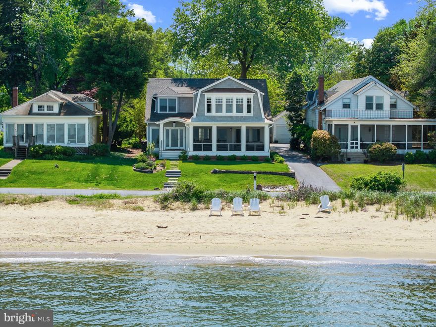 Gorgeous coastal style home in the coveted Bay Ridge community with stunning and thoughtful renovations that highlight the expansive Chesapeake and Bay Bridge views! The extensive renovation by M Homes elevated the appeal and functionality of the home by adding 2 additional ensuite bedrooms and laundry room on the 2nd level and much more.  No expense was spared to make this a home of distinction, from the on trend wide plank white oak floors, to the stunning primary bedroom and bath, every detail was thought out and expertly executed.  The open floor plan allows water views from almost every room, the gourmet kitchen is perfect for entertaining and the main level bedroom with full bath provides options for one level living. Envision idyllic days filled with family and friends gathering in the perfectly perched screen porch to watch the endless activity on the Bay. Head upstairs and enjoy the amazing recent addition that boasts a convenient and expansive laundry room and 3 ensuite bedrooms, including the spectacular Primary suite.  Savor the breathtaking panoramic Bay views from sunrise to sunset from the comfort of your bed! The renovation of the 2 car detached garage ensures shelter for your vehicles and delivers additional living space with the upper level bonus room/office space. Beach access to the Bay right out your front door ensures endless opportunities to relax at the water's edge, watch the waves and sailboats, cool off on summer days and enjoy the waterfront lifestyle! The sought-after Bay Ridge Community features a plethora of amenities including community pool with a clubhouse that overlooks the beautiful waters of the Bay, community beaches on both the River and the Bay and a community Marina with a newly renovated clubhouse. Off-the-water activities include enjoying the basketball court, playground, ball fields, pickleball courts, common areas and year-round community activities. Walk or ride your bike for miles along the water and enjoy all the benefits of the Bay Ridge lifestyle, there is no other place like it! Located just minutes from downtown Annapolis and Eastport which offer the perfect balance of small-town charm and big world sophistication. Traveling or commuting is just as convenient by easily accessing Rt. 50 and 97 which provides direct access to Baltimore, BWI, Ft. Meade/NSA and Washington, DC., or head over the Bay Bridge to the Eastern Shore for a quick beach vacation.