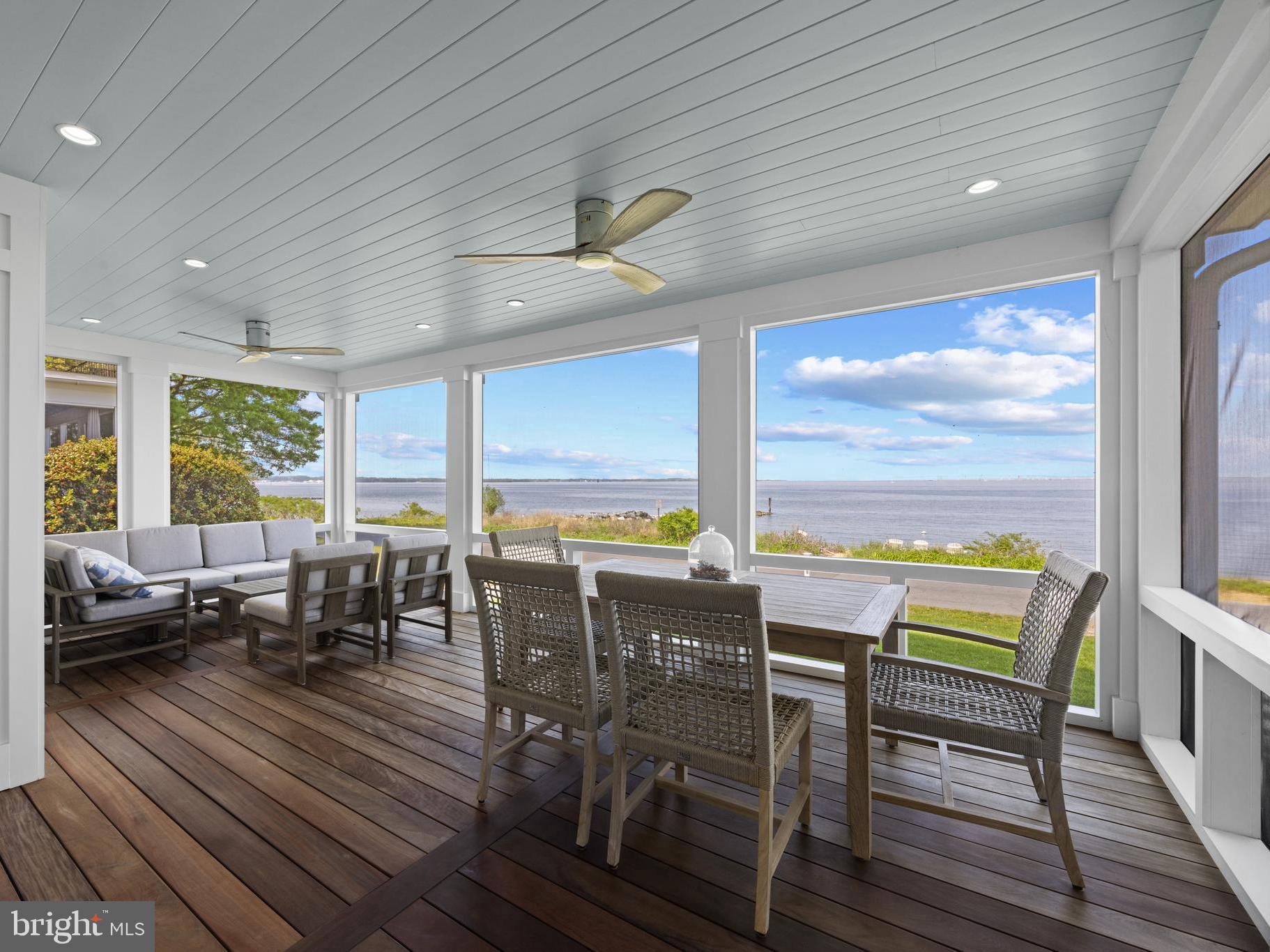 Gorgeous coastal style home in the coveted Bay Ridge community with stunning and thoughtful renovations that highlight the expansive Chesapeake and Bay Bridge views! The extensive renovation by M Homes elevated the appeal and functionality of the home by adding 2 additional ensuite bedrooms and laundry room on the 2nd level and much more. No expense was spared to make this a home of distinction, from the on trend wide plank white oak floors, to the stunning primary bedroom and bath, every detail was thought out and expertly executed. The open floor plan allows water views from almost every room, the gourmet kitchen is perfect for entertaining and the main level bedroom with full bath provides options for one level living. Envision idyllic days filled with family and friends gathering in the perfectly perched screen porch to watch the endless activity on the Bay. Head upstairs and enjoy the amazing recent addition that boasts a convenient and expansive laundry room and 3 ensuite bedrooms, including the spectacular Primary suite. Savor the breathtaking panoramic Bay views from sunrise to sunset from the comfort of your bed! The renovation of the 2 car detached garage ensures shelter for your vehicles and delivers additional living space with the upper level bonus room/office space. Beach access to the Bay right out your front door ensures endless opportunities to relax at the water's edge, watch the waves and sailboats, cool off on summer days and enjoy the waterfront lifestyle! The sought-after Bay Ridge Community features a plethora of amenities including community pool with a clubhouse that overlooks the beautiful waters of the Bay, community beaches on both the River and the Bay and a community Marina with a newly renovated clubhouse. Off-the-water activities include enjoying the basketball court, playground, ball fields, pickleball courts, common areas and year-round community activities. Walk or ride your bike for miles along the water and enjoy all the benefits of the Bay Ridge lifestyle, there is no other place like it! Located just minutes from downtown Annapolis and Eastport which offer the perfect balance of small-town charm and big world sophistication. Traveling or commuting is just as convenient by easily accessing Rt. 50 and 97 which provides direct access to Baltimore, BWI, Ft. Meade/NSA and Washington, DC., or head over the Bay Bridge to the Eastern Shore for a quick beach vacation.