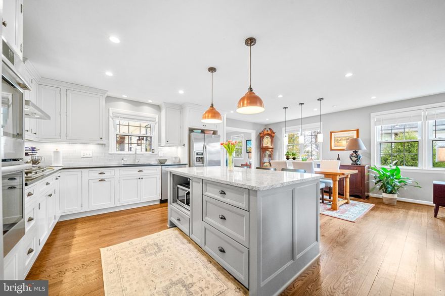 Beautifully updated 4BR/3BA home in the sought-after Country Club Manor section of Chalet Woods in Centreville, offering over 2,600 ft² on a 0.24-acre lot. This well-maintained home features a rare 407 ft² addition creating a bright den/sitting/reading room, a remodeled kitchen (2015) with double ovens, granite counter and touchless faucet.  Beautiful hardwood flooring throughout, and a renovated primary bathroom with custom tiling. The home has been extensively updated with Roof (2019), HVAC (2023), commercial-grade gas water heater (2022), washer & dryer (2022), dishwasher (2024).  Updated energy efficient windows. Enjoy outdoor living on the screened porch and deck overlooking the backyard, while the finished lower level offers flexible space for a recreation room, guest area, office, or gym. Wood-burning stove, spacious living areas, and thoughtful improvements throughout make this home truly move-in ready. Ideally located near shopping, dining, parks, and major commuter routes, this beautifully upgraded Centreville home offers the perfect blend of comfort, space, and convenience.  Homes in this neighborhood rarely offer this level of updates and living space. Schedule your showing today!