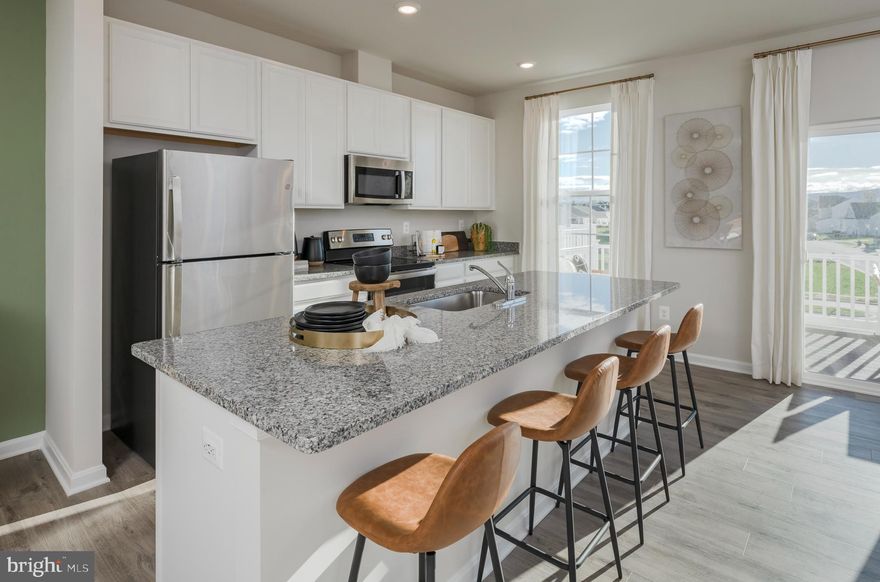 New 3-level townhome in sought-after Norborne Glebe! Spacious smart home with finished lower level rec room beautiful kitchen with stainless steel appliances and granite counter tops, and 2 pendent lights above the island, 1-car garage, washer/dryer package, spacious deck and more! Call our Lennar New Home Consultants to schedule a tour today. This home won't last long! Delivery September 2023.