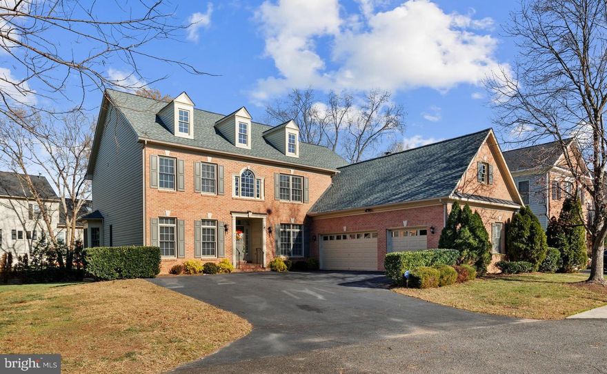 This stunning Craftmark-built colonial home, rarely available in the sought-after Hunters Crest community of Kingstowne, Alexandria, offers over 5,600 sq. ft. of expansive living space. Situated close to shops, dining, entertainment, and top-rated schools, this residence features 5 bedrooms, 4.5 bathrooms and a 3-car garage. Upon entering the grand two-story foyer, you'll find formal living and dining rooms perfect for entertaining. The home office includes built-ins and French doors, while an oversized, light-filled family room with custom shutters and a gas fireplace serves as the central gathering space.
The gourmet kitchen is equipped with stainless steel appliances, granite countertops, white cabinetry, a spacious walk-in pantry, double ovens, GE Monogram refrigerator, and spacious island with gas cooktop for both functionality and entertaining. The adjacent breakfast room, kitchen counter bar, and desk space offer ample room for family and friends.
Upstairs, the primary bedroom suite boasts two custom walk-in closets (California Closets) and a luxury bath with an oval tub and separate shower. Three additional bedrooms and two full bathrooms complete the upper level, which also includes a convenient laundry room.
The lower level is designed for recreation, with space for a pool table, a gym, various entertainment areas, and abundant storage in a large utility room. A fifth legal bedroom with its own full bathroom is also located on this level.
Recent upgrades include a new roof (2019), main-level HVAC replacement (2018), fresh carpet (2019), refinished hardwoods in main level 2019), and warm contemporary paint in Nomadic Desert by Sherwin Williams (2019), TREX deck added in 2020. Additional features include a sprinkler and irrigation system, an oversized three-car garage, and extensive closet and storage space. With easy access to major transportation routes, Ft. Belvoir, Old Town, the Pentagon, Georgetown, Joint Base Anacostia-Bolling, Walter Reed Hospital, and Washington, D.C., this exceptional home offers both luxury and convenience. Don't miss the opportunity to make it yours!