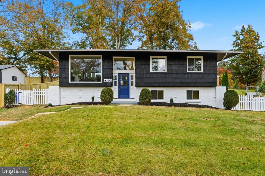 Welcome to this beautifully renovated split foyer home in one of Rockville’s most convenient neighborhoods.  Step through the striking blue front door and into a sun filled living area highlighted by a custom 6.5 foot by 8 foot front window that floods the main level with natural light. The open layout connects seamlessly to a bright, modern kitchen featuring stainless steel appliances, elegant white cabinetry, and a wide view window above the sink overlooking the backyard and patio.

Outside, enjoy a truly special retreat on the covered patio with an adjustable ceiling that opens and closes like blinds, allowing you to choose between sunlight or shade. This versatile space is perfect for outdoor dining, morning coffee, or evening gatherings with friends and family.

Throughout the home, new luxury vinyl plank flooring adds a clean and modern feel. The primary bedroom has been expanded to include a double sided hallway closet, providing generous storage and a calm private atmosphere. Additional updates include a brand new furnace and water heater, both running at approximately 90 percent efficiency, ensuring comfort and peace of mind for the years ahead.

Located near everyday conveniences, this home is minutes from Aspen Hill Shopping Center, Home Depot, LA Fitness, Rock Creek Park trails, and more. Major routes like Georgia Avenue and Veirs Mill Road are nearby, making commutes simple and quick.

With abundant natural light, thoughtful design, and a flexible outdoor living area, 13801 Lionel Lane is ready to welcome you home.