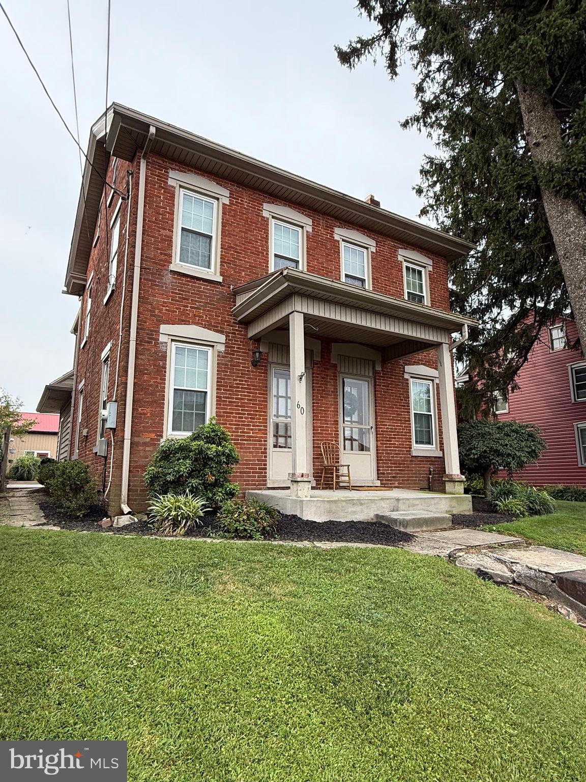 THIS PROPERTY IS GOING TO AUCTION ON THURSDAY SEPTEMBER 25, 2025 @ 6:00 PM. THE LIST PRICE ONLY REFLECTS THE SUGGESTED STARTING BID. Updated, clean 2.5-story brick home with detached barn on a .23 acre lot. First floor offers a remodeled kitchen, dining room with wainscoting, living room, office/hobby room, spacious full bathroom, laundry/mudroom. Second floor features primary bedroom with WIC, 2 additional bedrooms, common area reading/study room, and another WIC. Inviting rear concrete patio is great for entertaining. Detached 24' x 18' shop with second level mezzanine area, concrete floors, 150-amp service, space for a small car or great work shop. Stoned-in parking area at the back of the property.