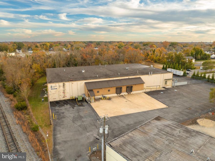 27,465 SF manufacturing and distribution warehouse in Salisbury sits on 4 acres. The property is fully fenced with exterior gated, fenced yard area. The building is fully sprinkled and features 24 ft ceiling heights in the warehouse, fully conditioned warehouse, and clean lab/production space that could either be repurposed or removed for additional warehouse space. With two dock high doors at the front of the building and one additional loading area with exterior dock high platform and double doors, the property is well suited for manufacturing and distribution uses. There is 3 Phase power, 200 amp, 120/240volt service. With close proximity to both Route 50 and Route 13, industrial users will experience ease of access, and minimal turns to major highway corridors.

+/- 7,000 SF of warehouse
+/- 20,465 SF office/lab/production space
3 dock high loading areas (1 leveler)
Enterprise Zone and Opportunity Zone Location