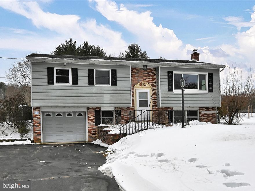 Your opportunity to own this affordably priced 3BR/2BA bi-level on 0.6 acre with a well-maintained, heated SALTWATER POOL is here! The home is located on a quiet road in the Pine Grove School District, offers beautiful mountain views, a large lot and a park/playground within walking distance.  Most windows have been replaced, and the HVAC system was replaced in 2021.  Some rooms have newer, laminate flooring. Spacious kitchen with easy access to the pool area and patio, which brims with functional, outdoor, recreational space! With a little TLC, it could be the perfect starter or even forever home.
The saltwater pool features a new liner, new pump, new resin ladder and has been maintained by Bob's Pools. The pool is 4ft to 8.5ft deep and has a separate heat pump. New roof in 2017. Newer garage door with electric opener. Updated electrical panel. Water filtration system and storage shelving included in sale. Freezer in basement included in sale.  Water heater 6-7 years old. Electric bill approximately $248/month.  Pine Grove is close to  major highways for easy commute or travel. Home of Sweet Arrow Lake County Park, Weiser State Forest, Swatara State Park. Rural charm! Envision all that this home could be; please schedule your tour and bring your best offer.