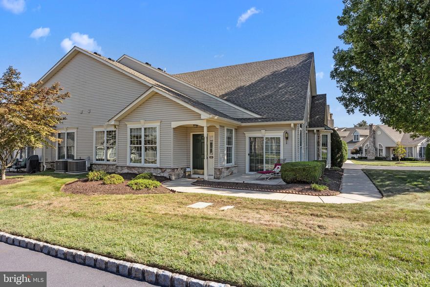 Welcome home to 201 Bellflower Road, a Rosewell Model Quad in the desirable 55+ community of Flowers Mill. Enter this home through the covered porch and be welcomed by a foyer leading to a large, open concept living room, dining room and kitchen setup with vaulted ceilings which add to the grandeur of the space.  Just to the left of the foyer, a set of double doors open into a den/study which makes for a cozy sitting room or private office space.  Back in the living room. don't miss the sliding glass door that will lead you to a patio perfect for relaxing and enjoying a morning coffee or grilling dinner for family and friends.   The nicely sized kitchen features granite countertops, stainless steel appliances, 42" cabinets, room for a kitchen table and a large pantry.  You'll love the first floor primary suite with vaulted ceilings, 2 sets of closets, a walk-in as well as an additional double closet, and an ensuite bathroom with double sink and stall shower.  The main level also features a second bedroom and additional full guest bath.  Finishing out the first floor you will find the laundry room with access to a 2-car garage with additional storage space, everything you need all on 1 floor!  But as a bonus, you will find a finished loft with half bath, a large space with so many possible uses, a secluded retreat for visitors, private office or hobby room, or just the extra storage anyone trying to down-size will love. This house has all the room you need to make it your home. Of Note: Roof (2022). Enjoy all the activities that Flowers Mill has to offer including a recently updated clubhouse, indoor pool, outdoor pool, tennis courts, bocce, NEW pickle ball courts, walking trails and a calendar full of events.