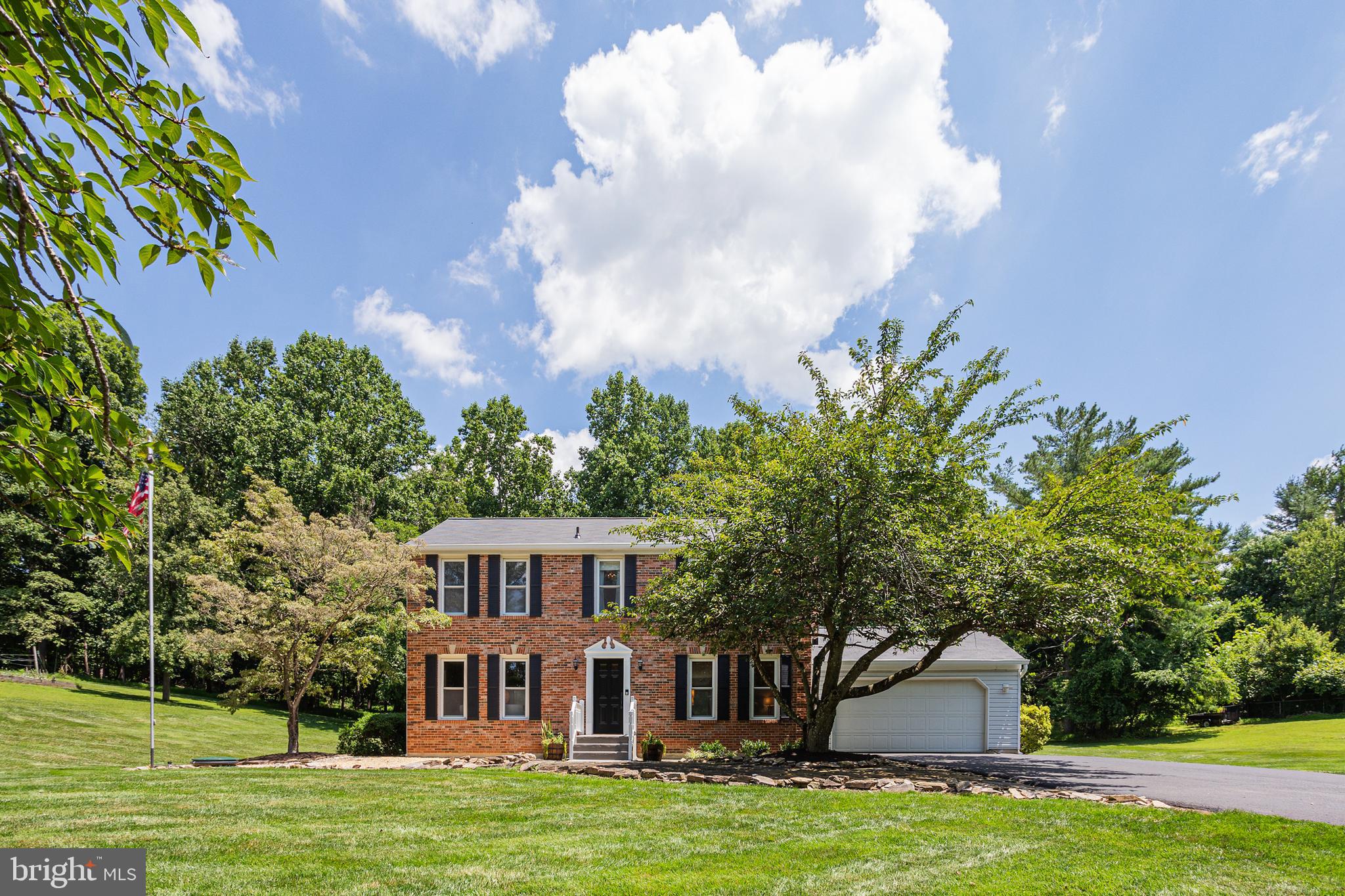This homesite says it all. Magnificient! The perfect place to call home. Spend time watching the wildlife, star gazing, or simply enjoying the spectacular view. Pull into the driveway and be transported to your private sanctuary nestled amongst nature. The main level includes a family room with a gorgeous centerpiece brick wood-burning fireplace. Enjoy cooking in the eat-in-Kitchen, with granite counters, and room for a breakfast table. Downstairs, endless options await. Move-in ready. The driveway provides ample parking. Rear yard with plenty of privacy for playing and entertaining. What an incredible opportunity...You simply will not believe the night sky! Sit back and relax. Relish in the change of seasons. Stunning in crisp white snow and equally gorgeous splashed with colors when in full bloom. Enjoy the feeling of privacy joined with convenience. This home is situated on a spacious homesite with serene views, with easy access to many local amenities and major routes. Roof replaced 2022.