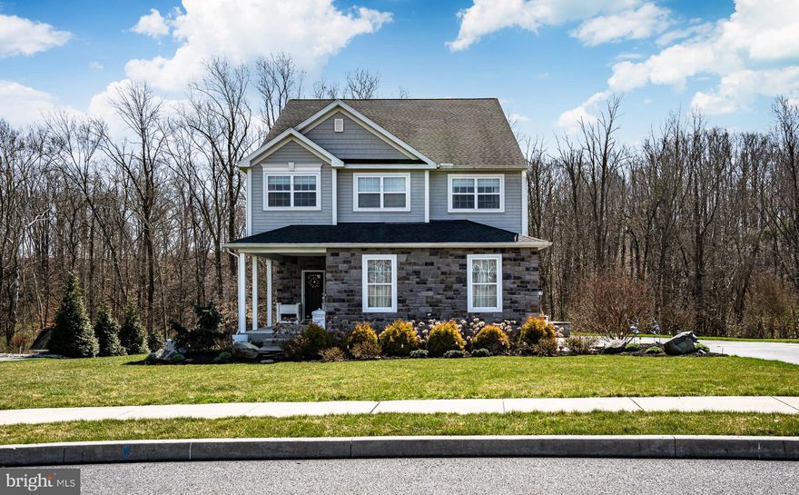 Welcome to 104 Pleasant View Dr, a charming 4 bedroom, 3-1/2 bath home nestled in the desirable Woods Edge community in Amity Township.  Boasting a 2 car side-entry garage & a beautifully-finished basement, this residence offers both convenience & comfort, with all the perks of a luxury community!

Everything about this open floor plan is fit for comfortable-living.  Upon entering, you are greeted by a bright, two-story foyer with slate colored, porcelain tiles.  You'll immediately notice the custom wainscoting & built-in bench in the oversized mudroom, which provides easy access to the driveway through a full-glass side door, as well as separate entry into the garage.  Beautiful luxury vinyl flooring extends throughout the first floor, which features a 'great room' comprising a kitchen, living room, and dining room.  Each room has a designated space, but the exposure, bullnose corners & overall flow of this unique floor plan provides a perfect balance for intimate family gatherings and space for entertainment.

The kitchen features an oversized island with ample seating for meals & socializing, beautiful granite countertops, staggered-height cabinets, a double-doored oversized pantry & matching stainless steel appliances.  The adjacent dining room includes custom crown molding to emphasize the ceiling soffit.  Heading through the sliding door will place you on the giant 16x16 foot deck, equipped with stairs that lead down to the backyard, a heavy-duty steel framed gazebo & fans with bistro lights to keep it cool on those warm summer nights. The living room joins the kitchen & dining room & features a beautifully crafted gas fireplace, which is surrounded by stone facade, a flagstone hearth & a stained mantle that unifies the warm but rustic wood & slate design elements throughout the first floor.  The 10-foot ceilings, heightened baseboards, elegantly updated doors & large windows emphasize the space. You will certainly never tire of the gorgeous view of the woods from inside this home!

Heading up the stairs you'll find an open hallway with banisters, which highlight the bright & airy feel of the home. The spacious owner's suite is the feature, which comes complete with a sizable walk-in closet & large ensuite bathroom for added convenience. The three additional roomy bedrooms share a modern hallway bath, equipped with a tub/shower combo.  The bathrooms on this floor feature water closets, which provide for a bit more privacy than your standard bathroom.  For added convenience, the full laundry room, complete with a large utility tub, is also located on this level. I can't help but note that you will be absolutely WOWED by the ample closet- and storage space throughout this home!

The basement of this home has been thoughtfully finished by the current owners, who opted for heightened 9-foot ceilings & Superior Walls, which keep it warm in the winter but cool in the summer. With a design similar to the first floor, the basement offers a second family gathering area with an elongated, five-foot wide gas fireplace surrounded by stacked stone that covers floor to ceiling!  Two additional "flexible" rooms are perfect for designated office or workout space.  The first features a full-window with views of the woods, the second has a full bathroom with an elegant & spacious stand up shower.  A separate storage room can be found opposite the basement's living space, which hides utilities (including a self-cleaning water softener) & offers lots of space for all your future storage needs.  Finally, the  glass french door provides walk-out access to the backyard.  From there you have direct access to the Manatawny Creek & community trails.

Woods Edge is a haven for outdoor enthusiasts, offering an array of amenities including walking  & bike trails; tennis, pickleball & basketball courts; soccer fields; with multiple playgrounds & picnic areas.