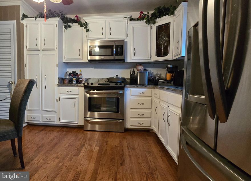 **OPEN HOUSE SUNDAY FEB 15 1-3PM** PRICED TO SELL QUICK!!.... Great location!! Spacious Solid Brick home located on a little over a 1/2 an acre of land, in a cul-de-sac. Home boast of large 2 car garage with high ceilings and attic space. Beautiful Hardwood flooring throughout. 5 Bedrooms converted to 4.... the primary bedroom has an expansion, ensuite; soak tub with jets, separate shower. Separate formal dining room, table space in kitchen, stainless steel appliances, granite countertops, deep double sinks; ceiling fan; large laundry room, 2nd refrigerator in there, stays; wet bar, wood burning marble fire place, extra storage space under stairs; regularly well maintained hot water heater and boiler; 3 year old A/C unit; newer roof approximately 10 years old; screened in porch, walk out onto the very large level back yard; decorative small fish pond needs liner; also the yard has a serene patio area. A country feel. Convenient to shopping and restaurants. Minutes to Cosca Regional Park, MGM National Harbor and Casino, TANGER Outlets, Washington DC, VA, and Southern MD.  
Come see the possibilities......