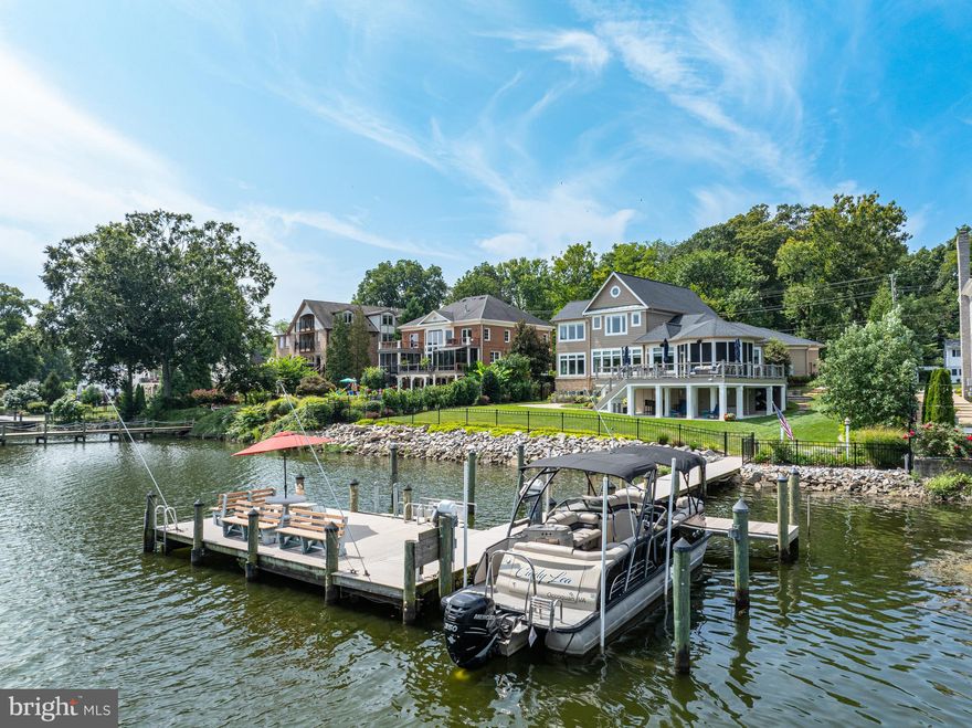Imagine the fun of walking out on the dock and taking your boat up to Alexandria for lunch. This gorgeous home embraces Coastal architecture and design with stunning river views. Enjoy evenings on the deck with friends, having dinner on the screened-in porch, or taking an afternoon nap on the lower patio watching the activity on the Occoquan. Many custom updates. The gourmet kitchen is ideal for the seriously social chef who wants to prepare a favorite dish and still be the center of the party! Anyone searching for an owner's suite will love the tall windows overlooking the river, custom built-in cabinetry with deep drawers, walk-in closets, and a luxurious owner's bath. Have your guests stay upstairs in one of the bedrooms. All of the full baths have been custom remodeled including in the lower level's fifth-bedroom suite. Enjoy the 85' dock which includes a sitting area, kayak launch, electric boat lift, electric power, and a faucet for fresh water. There is an oversized, side-load garage with storage cabinets including a Tesla charger. All grounds were professionally landscaped for year-round beauty and additional privacy. Uniquely set in the historic Town of Occoquan, enjoy a short walk or bike ride in to town to shop, grab a cup of coffee at Grind N Crepe, have dinner at The Secret Garden, or spend an evening with friends at Mill Street Draft. And make sure to explore River Mill Park.