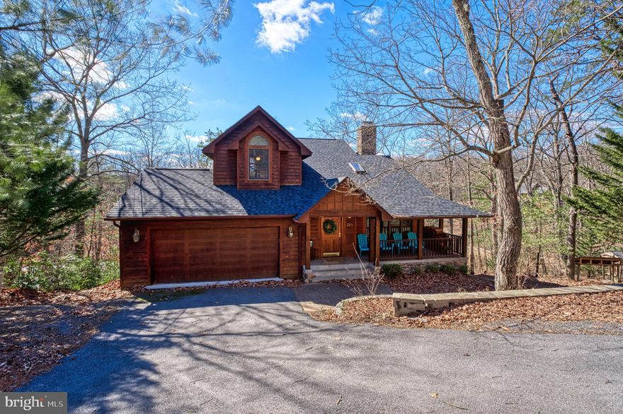 Welcome to your dream lakefront retreat in the sought-after Lake Holiday Community! This stunning cedar home offers three levels of living with breathtaking lake views and direct lakefront access. This home is designed for relaxation and entertaining, featuring 3 bedrooms, 5 bathrooms, and a loft with built-in bookshelves. 

The open-concept kitchen flows seamlessly into the living and dining areas, where a wood-burning fireplace adds warmth. and charm along with a 2-level ceiling and skylight. 
 Step outside to multiple spacious decks, perfect for unwinding, and soaking in the natural beauty. 

With hardwood floors throughout, a new roof (2022), and a wooded lot offering privacy, this home is move-in ready! The 2-car garage and large closets in the basement provide plenty of storage. 

As a resident of Lake Holiday, you’ll have access to incredible community amenities, including tennis, volleyball, pickleball, and basketball courts, an 18-hole disc golf course, gravel and wooded trails, a dog park,, three playgrounds, and three community beaches. 

This is more than just a home—it’s a lifestyle.