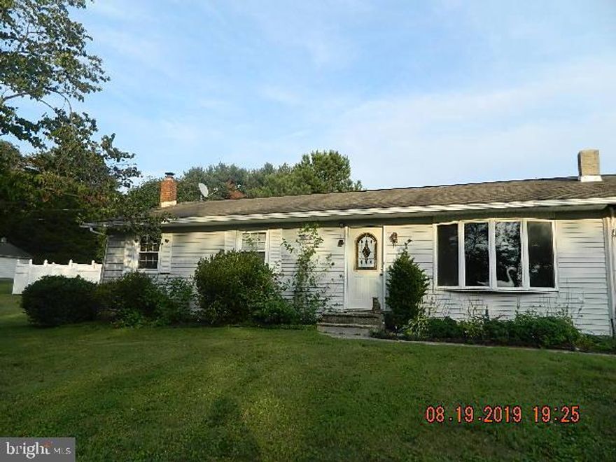 This house offers  three bedroom, two baths needs work. two car separate garage   Addition added but not finished.  Needs work