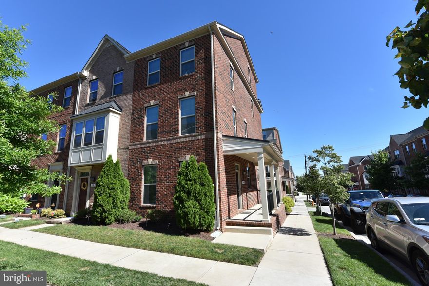 Rarely Available Gorgeous Brick End of Group Townhouse with Spacious Porch at O'Donnell Square with a 4th level loft style suite, open floorplan, garage parking, and tons of high-end upgrades! Entering from the Expansive Covered Porch you have a bright and inviting family room, Den/Office space or playroom. There is a well-appointed half bath with plenty of natural light just off the entry as well as a door leading to the oversized attached Garage. As you ascend the Hardwood staircase to the main level you find more gorgeous wide plank hardwood on this sunny open floor plan level with large windows on three sides. Here you find an enormous gourmet kitchen with upgraded stainless appliances, granite countertops, tile backsplash and pantry. The Kitchen includes an Island that separates the dining area.  Off the Kitchen you will find the door that leads to the outdoor Deck, more space to entertain. The Living room is large, bright, inviting and wired for a great entertainment center. Continue to the next Floor you will find a well-appointed owners suite, with a lighted tray ceiling, two large closets, beautiful ceiling fan and light with an on-suite bath boasting upgraded tile, lighting, dual sink vanity and a xl shower with gleaming glass enclosure and dual waterfall shower heads. On the same floor you find an additional full bath, bedroom and your laundry center. And we are not done… On the next floor you will find a expansive loft style private bedroom with yet another on suite full bath and a walk in closet. O’Donnell Square was developed with the homeowners in mind. Step out your door on the porch find a lovely courtyard greenspace inviting and teaming with neighbors enjoying some relaxing group time. If you want to venture out of the community you can find Dining, Shopping and some of the most charming and popular neighborhoods and sights that makes Baltimore famous. So centrally located hop on 95, 895 or 83 in no time. You really do not want to miss this home!