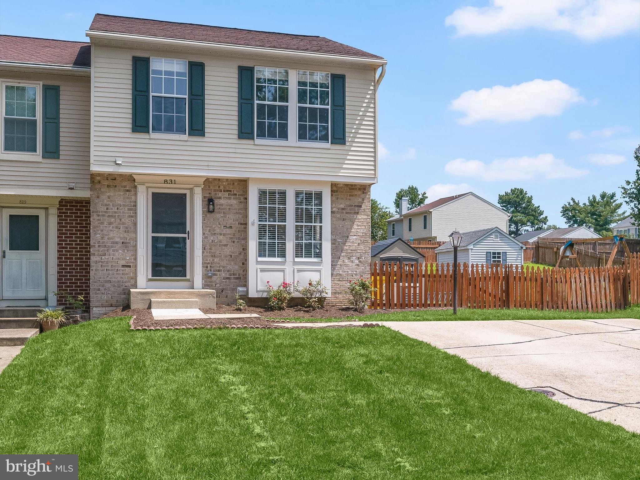 This spacious duplex home offers three finished levels of living space and a fenced backyard with a large deck, and boasts updates throughout including new LVP flooring and carpet, kitchen, all bathrooms, lighting package, and generator with a transfer switch. The sun-filled main level features new wide plank LVP flooring throughout and a bright living room with a breakfast bar that opens to the kitchen through a cutout. The dining room includes a modern chandelier and sliding glass doors that lead right out to the deck. The renovated kitchen is a standout, with white shaker cabinets, granite countertops, stainless steel appliances, and an island peninsula offering extra prep space. Upstairs, the primary suite sits under a vaulted ceiling and includes a beautifully updated en suite bath with a quartz vanity and beautiful tilework. Two more bedrooms, also with vaulted ceilings, and a second full bath complete the upper level. The finished lower level adds even more space with a cozy rec room featuring a gas-burning fireplace framed in marble, a walk-in closet with built-in organizers, a large laundry/storage room, and a bonus room that’s great for a home office or even more storage. There’s also a rough-in for a bathroom if you'd like to add one in the future. The fully fenced backyard includes a spacious shed and a freshly refinished deck backing to open space. All in a super convenient location close to major commuter routes, shopping, dining, and more.