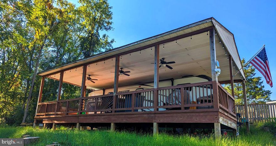 This is a gated community so you need to enter at the guard shack. Entry is not permitted without ID per the office rules. Bring ID's to the office or guard shack for visitor pass. THIS IS A SEASONAL CAMPGROUND! OPEN FROM APRIL 1 TO NOVEMBER 1.
** WELCOME TO RIVER BEND/SEASONAL LOT AVAILABLE TURN KEY** River Bend is a privately owned 400 acre recreational- vehicle camp resort with seasonal activities for members, families and guests. This great RV park is tucked away on the Upper Potomac River of West Virginia, River Bend is one of West Virginia's most popular family seasonal destinations. . Just a short drive from the Washington and Baltimore metro area. Open with utilities from April 1 to November 1. Lot owners have access to their property the entire year. *** Members Enjoy *** * Amazing views and wildlife, Potomac River access, Trails, Swimming pools, Mini-Golf, Youth center, Tennis and basketball courts, laundry facilities, convenience store, deli and lounge. *Bath houses through out the park, boat ramp, bar and grill and even a church located on the grounds. River Bend also hosts numerous activities such as 4th of July fire works, small carnival, bonfires, poker runs, horse shoe tournaments, car show, Halloween Trick or Treat and so much more. 
***Property Details ***  Great Lot that backs to trees with no one behind you.  Pavilion with deck.  If buyers are interested the seller will consider selling the camper.
Come and check out this amazing lot  **** Lets bring an offer to to table! ***BRING YOUR BEST OFFER*** YOU WON'T WANT TO MISS THIS ONE.***