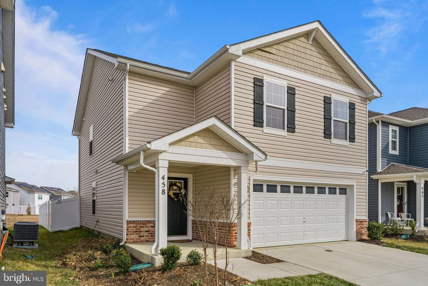 Built in 2023 and beautifully maintained, this 4-bedroom, 2.5-bath colonial offers modern comfort with timeless style. The inviting layout features warm wood floors and an open main living area designed for everyday living and entertaining. The kitchen is a true centerpiece with a spacious central island, stainless steel appliances, and plenty of cabinetry for storage and meal prep. Upstairs, the generous primary suite provides a relaxing retreat with a large walk-in closet and private bath. Three additional bedrooms offer flexibility for guests, work-from-home space, or hobbies. Outside, enjoy a fully fenced backyard perfect for gatherings, play, or pets. An attached 2-car garage adds convenience and extra storage. With like-new construction and thoughtful finishes throughout, this home combines the benefits of modern design with the comfort of a welcoming neighborhood setting. Move-in ready and waiting for its next owner to enjoy.