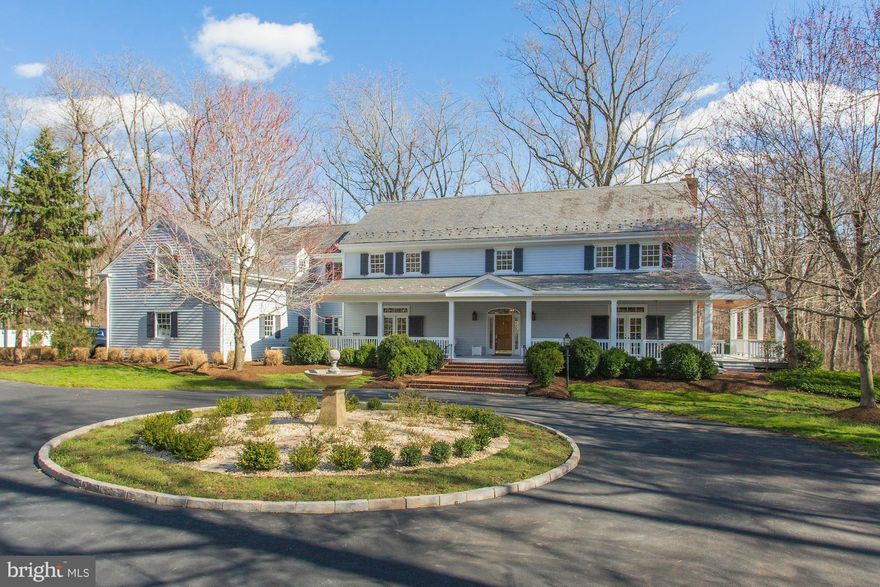 The lovely home is the perfect combination of elegance & privacy. The welcoming front porch ushers you into uniquely appointed rooms w/ wide plank HDWDS, 10' ceilings, customized moldings, huge windows, french doors, a true gourmet kitchen w/ 2 islands, 2 FRPLs, all BDRMs have en suite baths, basement wired for tv projector & speakers, 3 car garage, in ground pool..a magnificent home