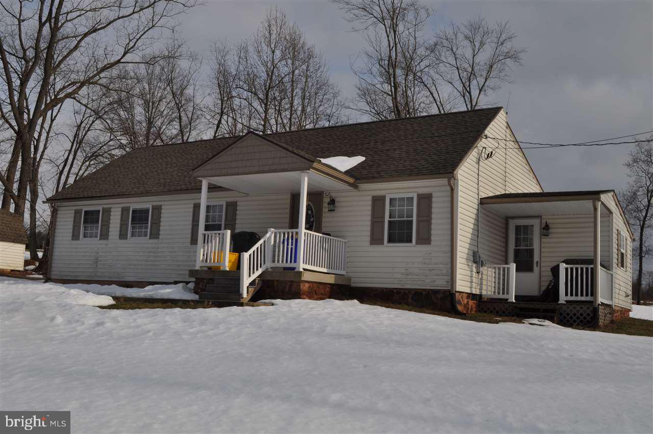 A true country setting with everything you want in this totally renovated rancher. Open floor plan Family room with vaulted ceiling Oak kitchen includes appliances Trek deck for entertaining Formal dining room 3 bedrooms Laundry with 1/2 bath 2 sheds convey.