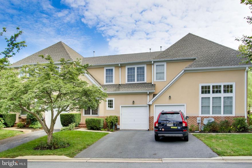 Welcome to 8818 Howard Forest Lane in the coveted Grey Rock community!  This home is full of high end renovations, starting with gleaming hardwood floors as you enter the living room and they continue throughout the main level.  The living room is oversized and has great sightlines into the kitchen which makes the flow of the space perfect for entertaining.  The kitchen offers ALL the bells and whistles you could hope for.  There is a giant center island, extra built in cabinet space, stainless steel appliances, granite counters with a leathered finish for a unique designer touch. The dining room opens to the sun drenched kitchen and has a trendy stone surround fireplace for the cozy winter evenings.  Travel upstairs to a TRUE primary suite with soaring vaulted ceilings, recessed lighting, walk in closet, and luxury master bath with separate soaking tub and designer tiled frameless shower.  This is where you will want to relax after a long day at work.  The other two bedrooms are spacious with fantastic closet space.  There is a deck off of the kitchen for an outdoor retreat and the community has a swimming pool for lots of outdoor fun!