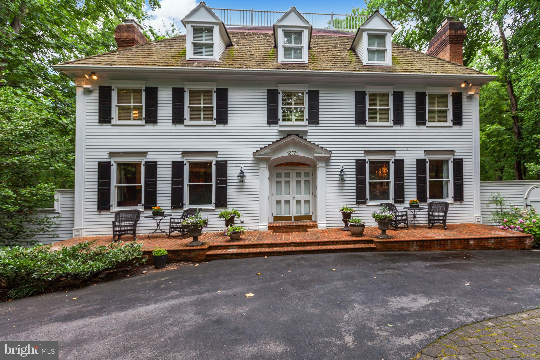 Stunning New England Colonial with grand entertaining space -- yet a very warm and welcoming feel to gather family and friends! Exquisitely renovated kitchen flows into a 2-story great room w/incredible views. Luxurious guest suite w/all amenities, Finished LL. Huge 2 story Deck, Screened Porch, 4 car garage, Neighborhood trails to C&O Canal!