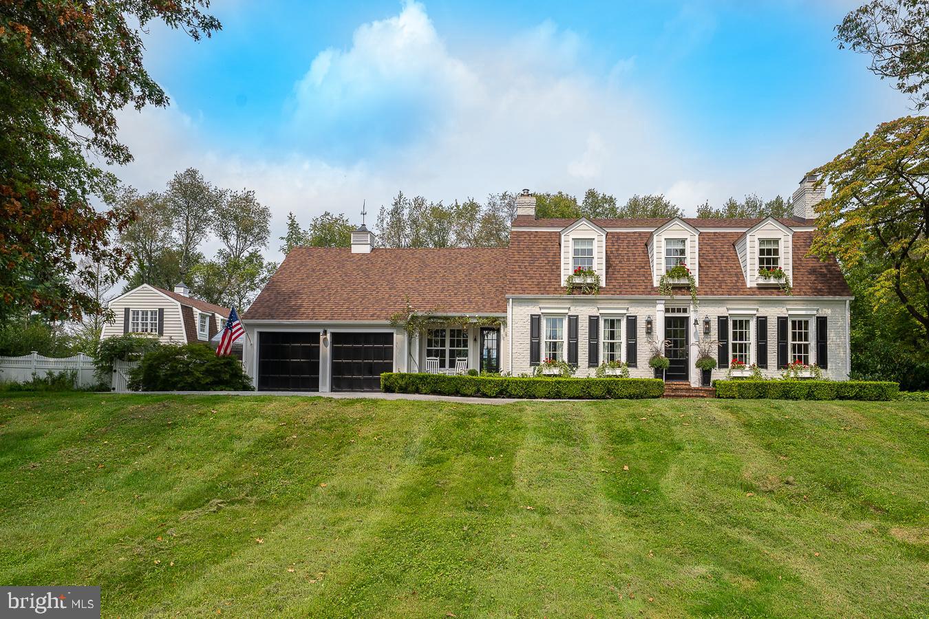 Welcome to Fox Hill Farm the perfect environment for today’s work-at-home lifestyle. This special property is comprised of a Main Home and a separate detached Carriage House offering combined living space of over 4300 sf plus a pool and greenhouse- all of which has been lovingly renovated down to every last detail and sits on over 2.5 acres of manicured level ground on a cul de sac street. The Main Home features 4 nice size bedrooms, 3 new full baths, and 3 working fireplaces. The first-floor bedroom is currently being used as an office but is easily converted to a bedroom. The bright and refreshing chef’s kitchen has been reconfigured and renovated with quartzite countertops, a Kohler farmhouse sink, a Wolf 6 burner gas stove, and offers island seating. The sun-drenched family room with its beamed ceilings, built-in shelving, original brick wall, and wood-burning fireplace offers a delightful place off the kitchen to relax and provides access to both the charming front porch where one can overlook the sprawling front lawn or the backyard oasis to enjoy al fresco dining on the expansive brick patio, swimming in the heated pool or the tranquil surround of your own private estate. From the painted brick floor entryway to the sea grass-lined kitchen cabinetry no detail has been overlooked while still retaining the charm of Fox Hill Farm. Across the patio, you will find the newly renovated 1800 sf Carriage House complete with a full bath, kitchen, and living area with 2 additional garages. A perfect space for a home office, au pair or in-law suite, or simply a guest house. Located only a mile from the Amtrak stop on the Main Line direct to NYC, the R5 to Philadelphia, and in the top-rated T/E school district with numerous private schools nearby as well as minutes to downtown Paoli with an abundance of shops and restaurants to explore- Welcome home to Fox Hill Farm!