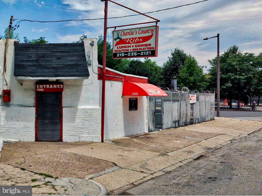 Corner Quick Service Restaurant Opportunity for Sale: Recall the many iconic pork, steak, hoagie, and BBQ quick-service sandwich shops throughout South Philly? Well, here is your opportunity to take a 30-year beloved corner BBQ restaurant to the next level to become the #1 BBQ destination in the market area for a great bite. Build and fine-tune your custom business - smoke, grill, fry, or roast - in an improving area in North Philly on the west side of the Diamond Street corridor. There is nothing else like it around. ||

You can purchase this 3-lot package with a 100' front and a 4,251 SF total footprint through an SBA-7A loan, putting down 10% on a 25-year mortgage and a monthly payment of less than $3,128. That's much better than renting. Although this property operates as a turnkey restaurant, additional funds are built into the SBA-backed lender's package for improvements that enable the new owner to make personal changes strategic to their business model. The additional project funds enable the new owner to design and configure the service and production areas to reflect their custom improvements. For example, we recommend creating an ordering window that faces Diamond Street. ||

This corner quick service restaurant sale offers a rare opportunity to own a CMX1-zoned 2,084 SF primary corner parcel with 1,550 SF building space anchoring a proven 30-year BBQ business. Located on a prominent triangular corner lot at 25th Street and the bustling Diamond Street corridor, this parcel includes a working commercial kitchen, equipped with a gas griddle, deep fryer, and stove-ovens with a hood and fire suppression system, refrigerators, commercial equipment, and storage. ||

The adjoining 32' double-wide lot is 2,167 SF, zoned RSA-5, it can serve, with a variance, as a casual outdoor dining area for customer use or restaurant expansion. ||

Registered and compliant, this humble business has operated smoothly with a clean record from the Department of Licenses and Inspections (L&I), free from building or licensing violations. This operational integrity ensures a hassle-free transition for new ownership and reflects the property’s strong foundation and established reputation.

Tap into the steady through traffic flow across the Diamond Street corridor. This location benefits from the dynamic growth and revitalization in the nearby Brewerytown and Strawberry Mansion neighborhoods. These areas are emerging as vibrant communities, bringing new opportunities and an influx of interest from investors, businesses, and residents alike. ||

Create your core menu concept to drive repeat business, then let your business savvy kick in to grow a celebrated legacy business. ||

Alternatively, this corner three-lot package can also serve as a location for redevelopment.

Whatever your interest, consider this opportunity, and call today to clarify any details or to schedule an appointment.