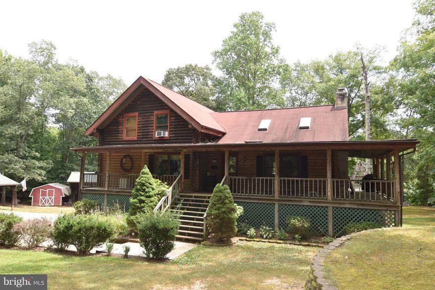 Log home on  3 acres off of Hawkins Gate Road.  Excellent location.  Main level master bedroom. Stone Fireplace, hardwood floors. Unfinished basement w/ rough in plumbing.  Out buildings.  House needs work. Sold "AS IS" . Estimate for some repairs attached. Needs new roof.   Cash or rehab loan . Shown by appointment only.  Owner related to listing agent.