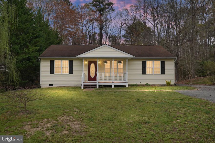 Enjoy one level living convenient to Fredericksburg, Fairview Beach, Caledon State Park and Dahlgren.   Welcoming covered front porch is 5 x 14.  This easy living home features split bedroom design, a sizeable great room and upgraded lighting.  Owner's retreat has walk-in closet, linen closet, dual sinks and large garden tub.  Kitchen features two pantry's, stainless steel appliances, lots of cabinets and granite counters.  Dining area opens up to huge tiered deck for entertaining.  Upper deck is 12 x 12 and lower deck is 11 x 14.   Yard is level and partially fenced.  10 x 14 shed has covered storage for your yard equipment or toys.  Home backs up to wooded area for privacy.  New hot water heater in 2024 and HVAC in 2018.  New roof with architectural shingles being installed.  Home being sold AS IS.  Community has state roads and the HOA is only $30 a year to maintain the entrance and stormwater management ponds.