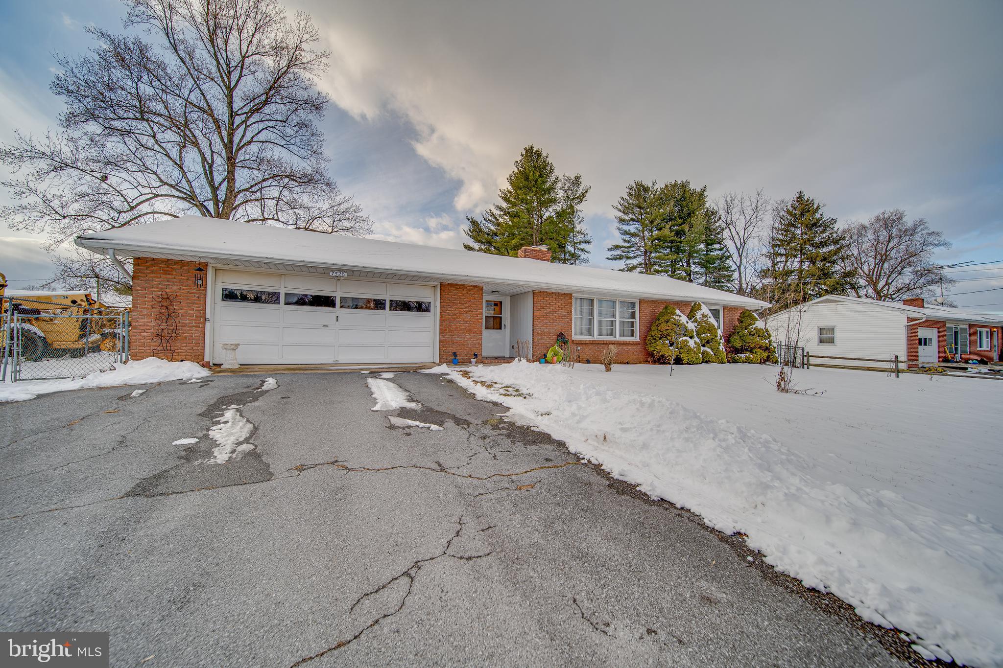 All brick rancher 2-3 bed 2 bath with oversized 2 car garage, large covered rear patio with BBQ area and fenced level backyard in desirable Sharpsburg. Full walkout basement with full bath and 2nd kitchen is perfect for an in-law suite or au pair. Family room has hardwood underneath and a wood burning fireplace with stone façade and wood mantel. Kitchen has a cooktop and wall over (as-is). Large garage equipped with drop down stairs for easy access to the attic and window AC. The walk-up basement to the rear yard has a wood stove in the rec room area, new flooring, full bath and kitchenette. House has all new electrical, plumbing, panel box, hot water heater, softener, and pressure tank. House runs off a heat pump with oil back up. Whole house fan. House is equipped with 2 electric meters should you like to rent out the basement level. NO HOA, NO RESTRICTIONS. Easy access to shopping, restaurants and major commuter routes. Sold strictly as-is.