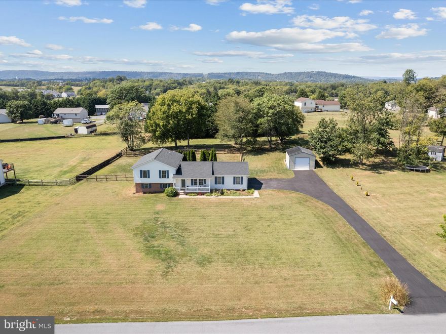 Meticulously maintained 3BR/2BA split-level on 1 acre in a great location just 3 miles from I81! Home includes fenced backyard, private patio, front porch, and beautiful landscaping. Features include 2-car attached garage, additional detached 18' x 20' garage, paved drive, new roof (2020), new HVAC (2024), and rough-in for lower level full bathroom. Turn-key and move-in ready!