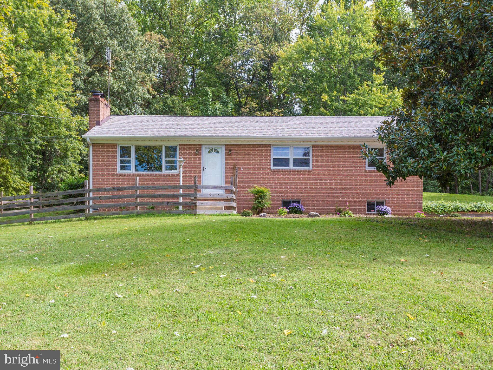 Brick Rambler on beautiful, private lot backing up to trees on almost 2 acres. 3BR/2BA w/ recessed lighting & newly finished hardwood floors. Eat-in kitchen w/ island & new stainless steel appliances! Recreation Room on lower level w/ tons of storage, utility room & a cedar closet. One car garage & barn/shed equipped w/ electricity. Perfect haven from DC! More photos in tour! Call today!
